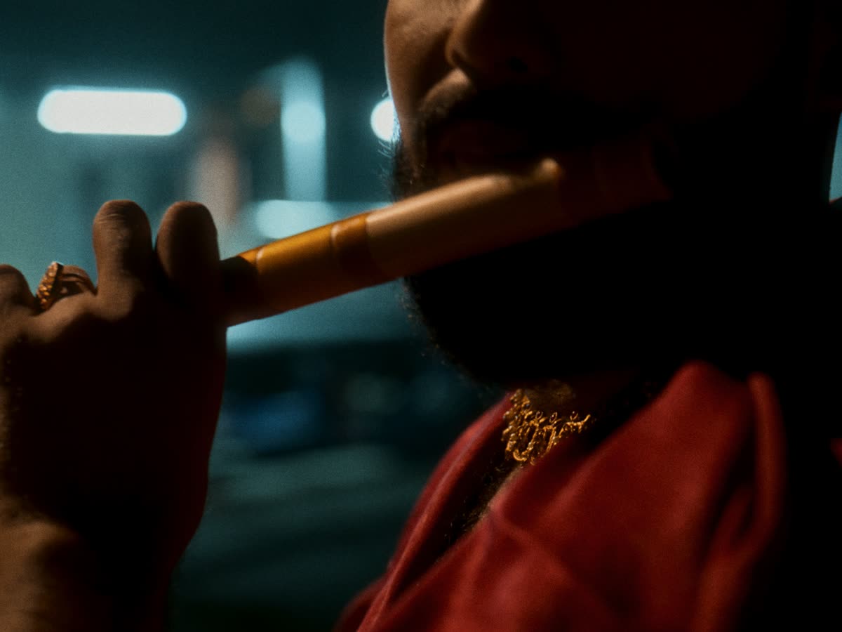 Close-up of a bamboo flute being played